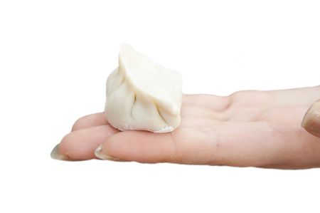 Chinese dumpling on palm isolated on white background.の写真素材