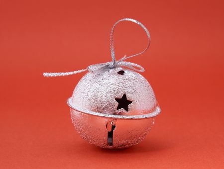 jingle bell on red background.の写真素材