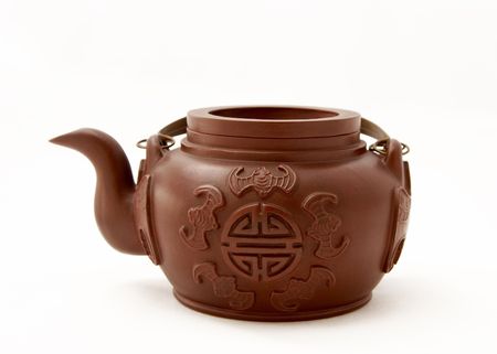 clay teapot isolated on white background.の写真素材