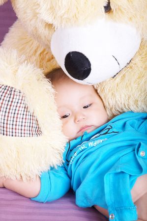 baby and teddy bearの写真素材