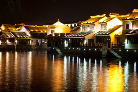 Traditional ancient town with reflection at night, suzhou, china.の写真素材