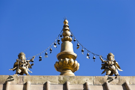 Gilded bodhisattva statues at the roof of temple, Lhasa, Chinaの写真素材