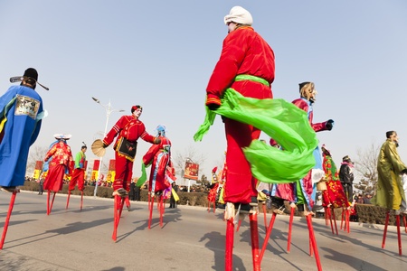 Yu County, Hebei province, China - February 5th, 2012: Chinese people celebrated the Spring Festival. The celebration activities are extremely rich and varied. People in my photo are showing stilt-walking that is folk performance.のeditorial素材