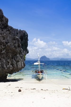 Lonely boat at beachの写真素材