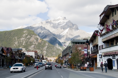 Banff, Canada - October, 5th 2012. Banff Avenue, shops and stores beside the street. Travellers and local people are walking along the main street.のeditorial素材