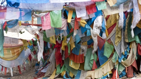 Tibetan prayer flags with ancient buddhism symbols and prayers written in sanskrit have been used in Buddhism for hundreds of years  Buddhists believe that they need to pray all the time, they tie colorful prayer flags which are flown to bring blessings aのeditorial素材