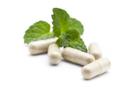 Organic capsule on mint leaves の写真素材