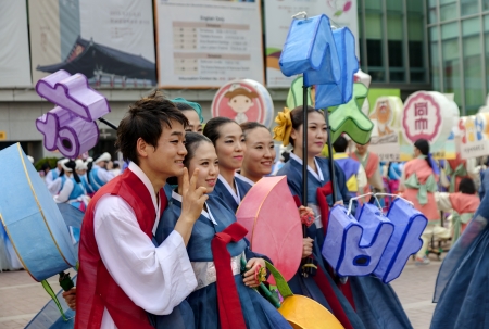 Seoul, South Korea - May 12, 2013: Young people wearing traditional clothes are taking pictures before participating Culture Performances for celebration of Lotus Lantern Festival at Jogyesa Temple, Seoul, South Korea. Buddha?s birthday is a major event oのeditorial素材