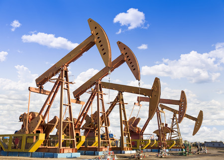 oil pump jacks working at dawn.の写真素材