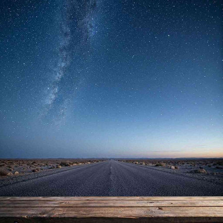 Empty wooden table with night sky and milky way. Collage.