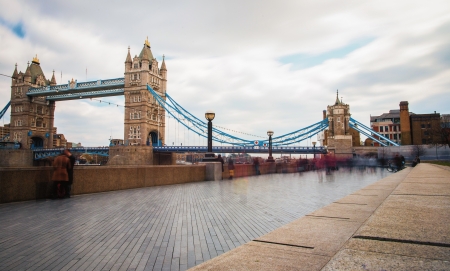 Tower Bridge, London with pedestrians on sidewalkの写真素材