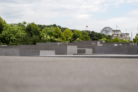 View of Reichstag Dome take from the Jewish Holocaust Memorial Park in Berlin, Germanyのeditorial素材