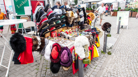 A stall selling soviet armies accessories at Checkpoint Charlie in Berlin, Germanyのeditorial素材