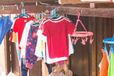 Clothes hanging to dry on a clothes-line.の写真素材