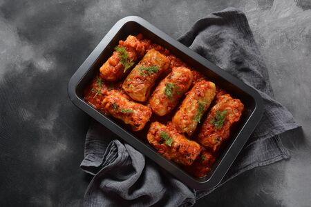 Cabbage rolls with chicken meat and rice in tomato sauce. Stuffed cabbage leaves. Delicious dinnerの写真素材