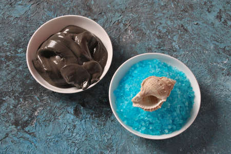 Spa and body care products. Colorful aromatic bath Dead Sea Salt and black Dead Sea Mud. Natural ingredients for homemade body scrub. Dead Sea cosmetics. Beauty skin care. Spa treatmentの写真素材