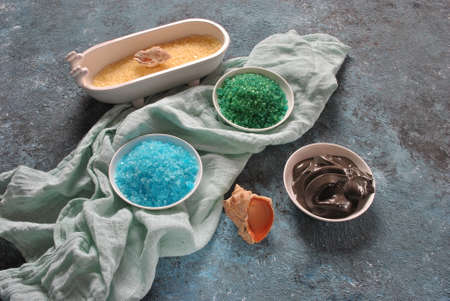 Spa and body care products. Colorful aromatic bath Dead Sea Salt and black Dead Sea Mud. Natural ingredients for homemade body scrub. Dead Sea cosmetics. Beauty skin care. Spa treatmentの写真素材