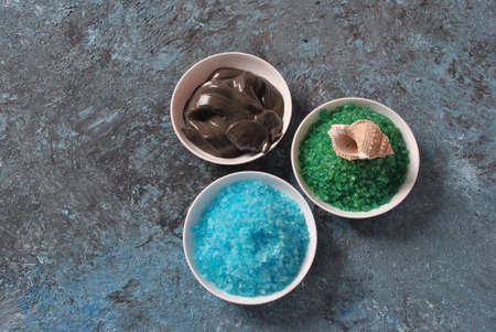 Spa and body care products. Colorful aromatic bath Dead Sea Salt and black Dead Sea Mud. Natural ingredients for homemade body scrub. Dead Sea cosmetics. Beauty skin care. Spa treatmentの写真素材