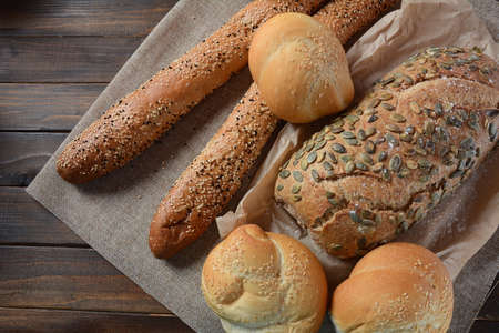 Bakery. Fresh fragrant baked bread. Homemade bread on wooden background