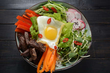 Traditional Korean dish- Bibimbap, rice with egg, beef and vegetables