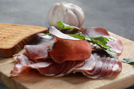 Italian Prosciutto Crudo or Spanish Jamon Serrano hamの写真素材