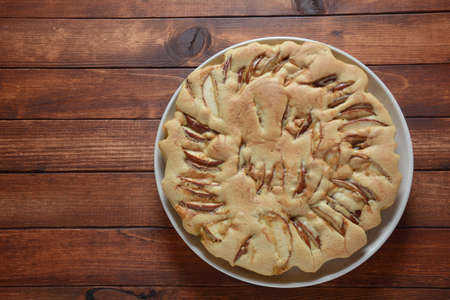 Homemade apple pie with sugar powder and cinnamon. Traditional American or English dessertの写真素材