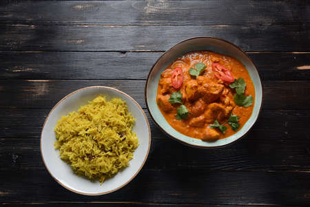 Chicken Tikka Masala- traditional Indian/ British dish. Chicken with curry, turmeric. Indean dinner concept. Asian, Indian foodの写真素材