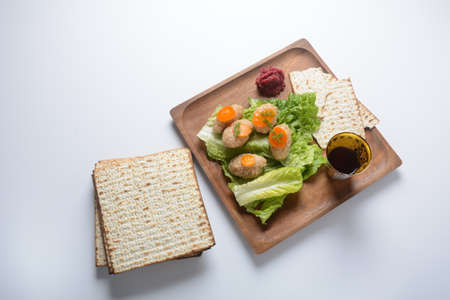 Passover traditional Jewish food- gefilte fish with carrots, lettuce, horse radish and matzah....