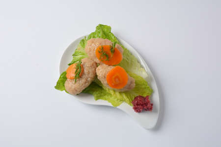 Passover traditional Jewish food- gefilte fish with carrots, lettuce, horse radish and matzah....