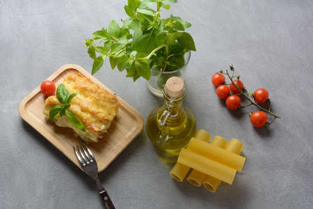 Cannelloni pasta stuffed with spinach, mushrooms,ricotta and sauce bechamel. Italian cuisine. Traditional food for Shavuot Jewish holidayの写真素材