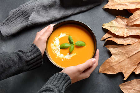Vegetarian autumn pumpkin and carrot cream soup. Thanksgiving dish. Healthy food conceptの写真素材