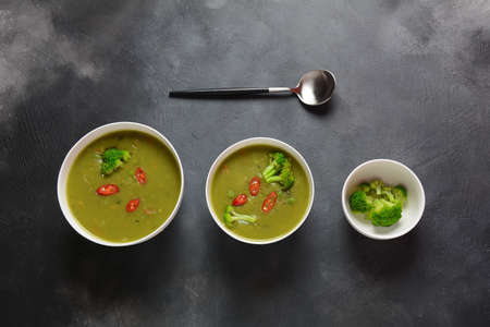 Healthy Vegan Creamy blended vegetable Soup puree with broccoli, celery, peas and carrots . Green detox  soup concept. Low-fat lunch.の写真素材