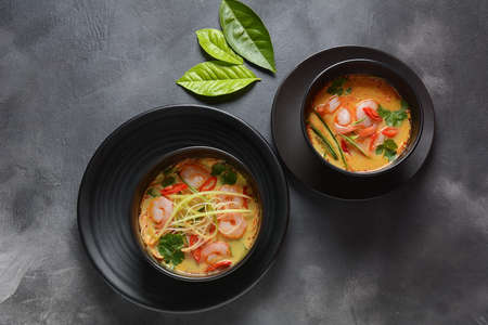 Laksa Soup â a Malaysian  Coconut Curry  Soup with shrimps over rice noodles topped with fresh bean spouts,cucumber, lime, red chili pepper and cilantroの写真素材