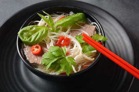 Traditional Vietnamese soup Pho bo with herbs,beef, rice noodles,chili and  bean sprouts . Vietnamese Cuisine. Asian foodの写真素材