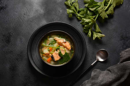 Fresh  fish soup on black backgroundの写真素材