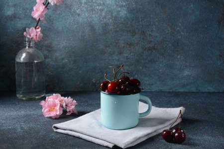 Sweet red cherries in a mug. Summer sweet dessertの写真素材