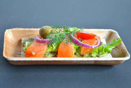 Healthy whole grain bread toast with avocado and salmon. Healthy Nutrition Dish. Salmon sandwich