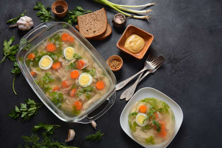 Home made aspic, jellied chicken meat with herbs and carrots. Traditional Russian dish holodets....