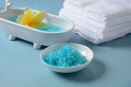 Spa and body care products. Aromatic blue bath Dead Sea Salt on the blue  background. Natural...