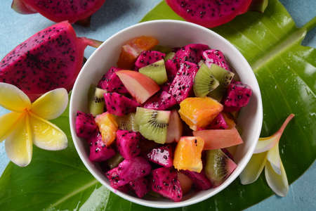 Dragon fruit (Pitaya, Pitahaya).Sliced pieces pitahaya fruit and fruit salad, and frangipani flowers.の写真素材