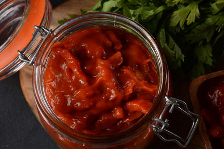 A jar of stewed salad with pepper and tomato(lecho). Traditional Hungarian dish