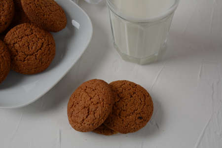 Chocolate chip cookies  with milk on white background