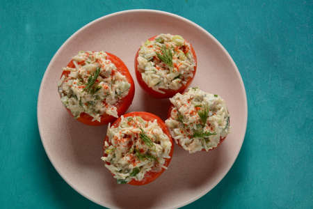 Tomatoes stuffed with rice, vegetables and meatの写真素材