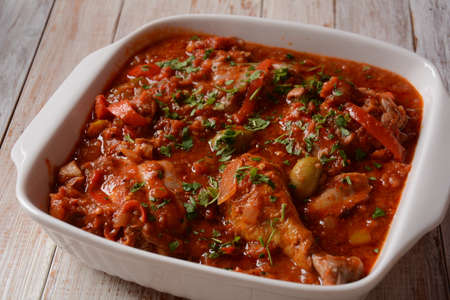 Chicken cacciatore with bell peppers, tomatoes, black olives. Italian foodの写真素材