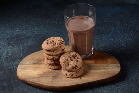 Chocolate chip cookies  with glass of tasty chocolate milk