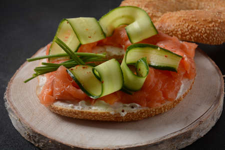Bagel sandwich with salmon, cream cheese, cucumber,の写真素材