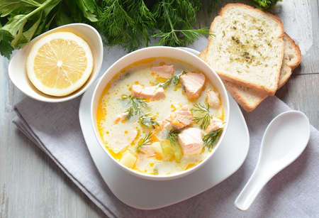 Creamy fish soup with salmon, potatoes, onions , carrots, dill and celery . Kalakeitto- traditional...