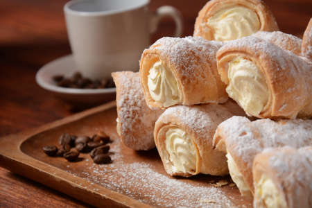 Elegant french cream horn pastries. Delicious cream horns filled with vanilla creamの写真素材
