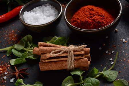 Variety of spices and herbs on kitchen table. Colorful various herbs and spices for cooking on dark backgroundの写真素材