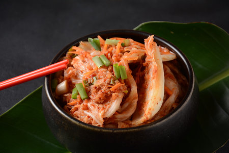 Kimchi and rice in black bowl with chopstick. Korean foodの写真素材